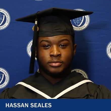 Hassan Seales, who earned his online associate degree in liberal arts, in cap and gown at Southern New Hampshire University's 2023 commencement ceremony.