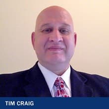 SNHU adjunct cybercrime professor Tim Craig in suite and tie