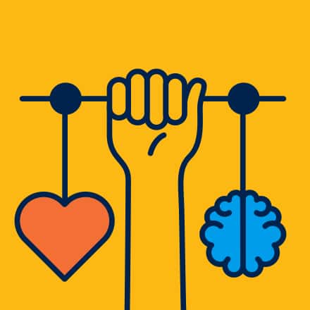 A yellow background with a cartoon hand holding a scale with a cartoon brain on one side and a heart on the other