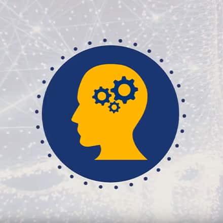 A blue and yellow silhouette of a man's head with gears inside that represents the types of psychology.