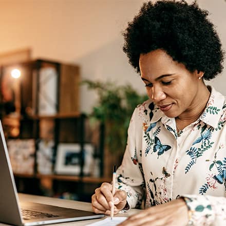 An online instructor using self-reflection, one of the best practices in teaching.