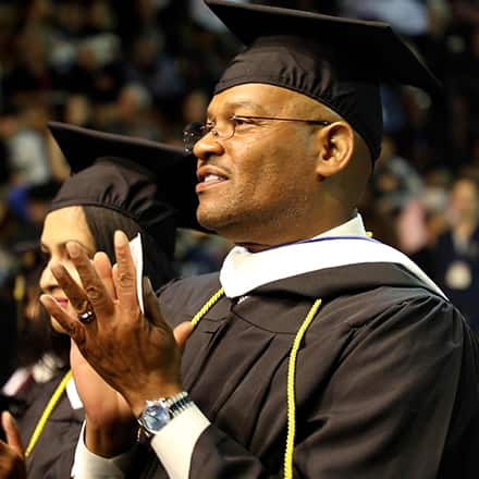 Father Michael Glenn attending SNHU spring Commencement 2023