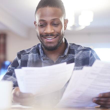 A man reads a financial award letter