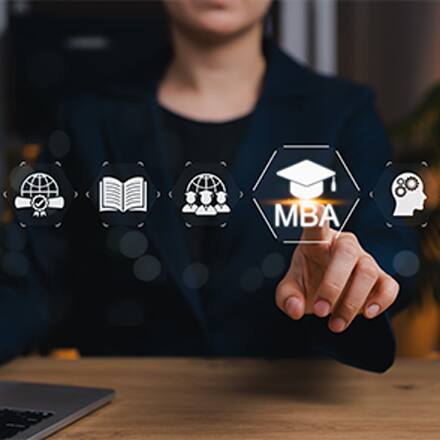 A person selecting an MBA icon on a virtual display with education and career symbols.