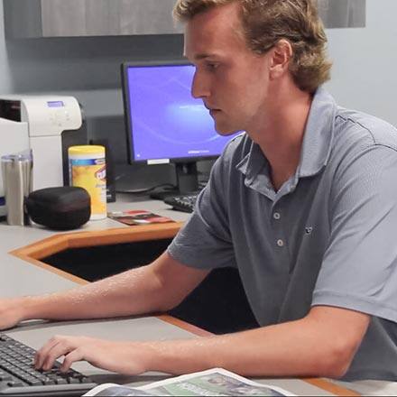 Kyle Dunlevy working at his sport management intern with radio station 98.5 The Sports Hub.