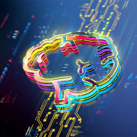 A neon outline of a brain lit up on a computer board to express the learning of AI