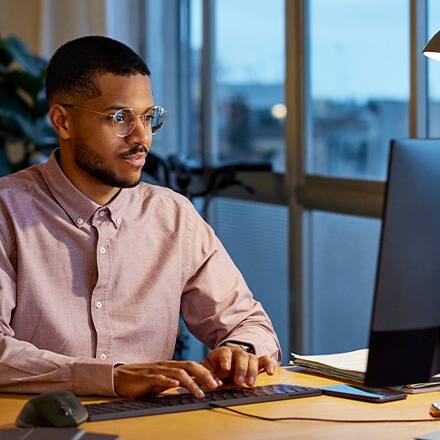 A business professional researching the best MBA programs.