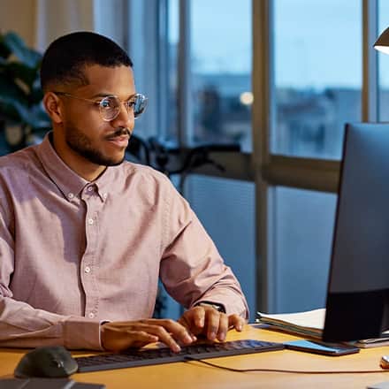 A business professional researching the best MBA programs.