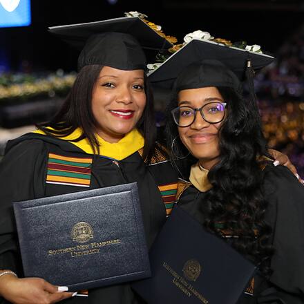 Mother and daughter Kim Medina and Chelsea Vega-Mitchell celebrating at Commencement