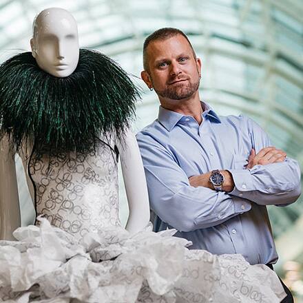 Ben Van Beusekom with an art piece he designed for a Disney theme park attraction.