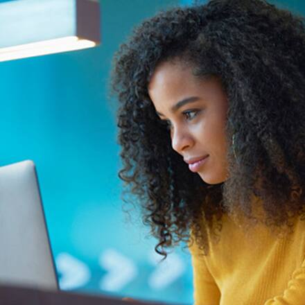 A college student using a laptop.