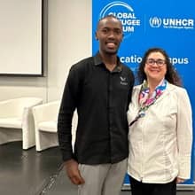 Rachael Sears standing with someone at the UNHCR Global Refugee Forum
