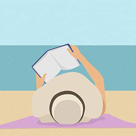 Illustration of a person lying on a beach towel by the water, wearing a wide-brimmed sun hat and holding an open book above their face while relaxing on a sandy beach.