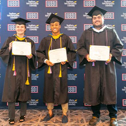 Adrianna Buxrude, Anthony Powell and Juvenal Rivera III with their diplomas
