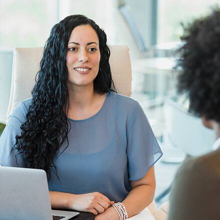 Two business professionals discussing what degree is needed for human resources