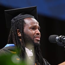 SNHU graduate Brandon Patterson speaking at his Commencement ceremony.