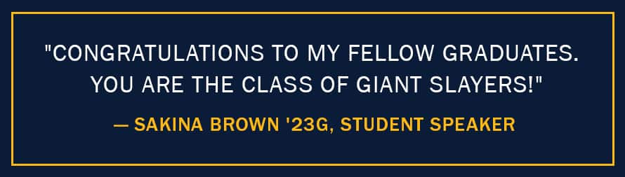 A blue infographic piece with the text "Congratulations to my fellow graduates. You are the class of giant slayers!" – Sakina Brown '23G, Student Speaker