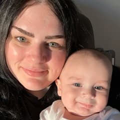 Athena Gouzoules, pursuing a cybersecurity degree at SNHU, with her son.