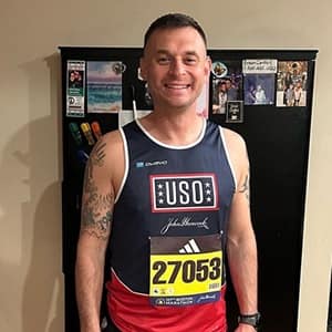 Robert Bruce wearing his Team USO shirt for the Boston Marathon