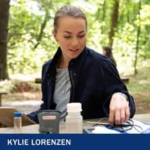 Kylie Lorenzen, a 2019 graduate of SNHU's environmental science program, conducting research in a forest