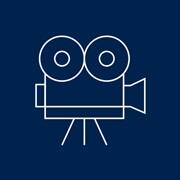 A blue and white icon of a movie camera