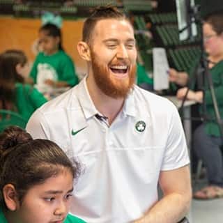 Celtics center Aron Baynes laughing while working with students of Fairgrounds Elementary