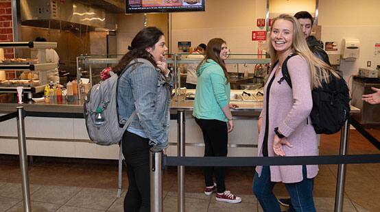 Students standing in line in the dining facilities