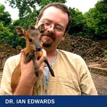 Dr. Ian Edwards holding a Red-flanked Duiker with the text Dr. Ian Edwards
