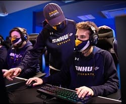 3 snhu esports players competing in a tournament 