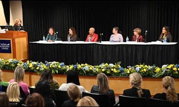 SNHU Chief Experience Officer Sue Nathan moderating the Women on Board panel of six SNHU Board of Trustees