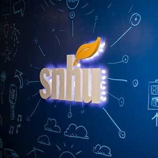 SNHU's logo illuminated on the wall of Inkwell Interactive Game Studio
