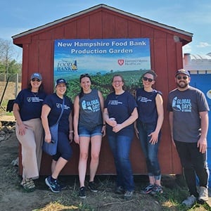 Six Global Days of Service volunteers at the New Hampshire Food Bank Production Garden