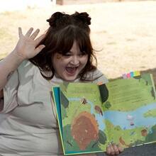 SNHU student Cassi Key reading a children's book about bees aloud.