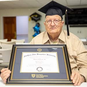 John Draper with his diploma