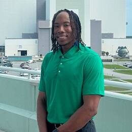 Justin Charles, a 2026 SNHU graduate with a bachelor's in cybersecurity, at his internship.