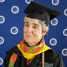 Lynda Jarrett, who earned her bachelor's in business administration from SNHU in 2023, wearing her cap and gown.