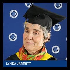 SNHU online business degree graduate and grandmother Lynda Jarrett at Commencement wearing her cap and gown.