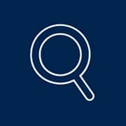 An icon of a white-outlined magnifying glass set on a blue background