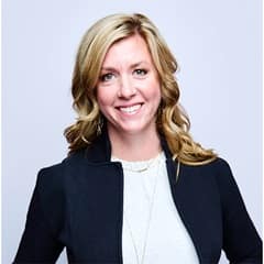 Marcy Vadurro, the associate vice president of strategic foresight at SNHU, wearing a dark blazer with a white shirt.