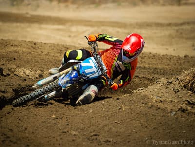 Marissa Markelon going around a tight curve on her dirt bike during a race.