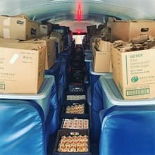 A school bus filled with Meals for Manchester supplies.