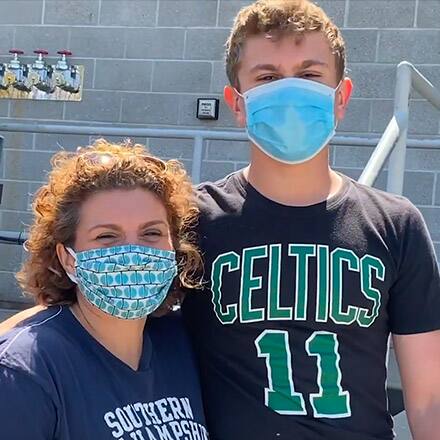  Jennifer Kidwell and her son, Jack, volunteering for Meals for Manchester.