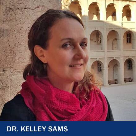 Dr. Kelley Sames, an instructor of anthropology and public health at SNHU, wearing a red scarf, as well as the text Dr. Kelley Sams.