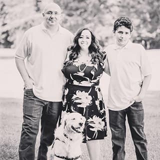 Jennifer Ready with her husband, son and dog