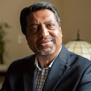 Dr. Ranjit Nair, an adjunct faculty member in SNHU's online MBA in Human Resources program, wearing a sports coat and button down shirt.