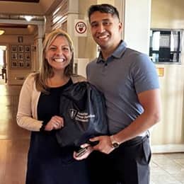Sonali Mukerjee, SNHU director of partnerships and military marketing, left, with graduate Ricardo Troche, right.