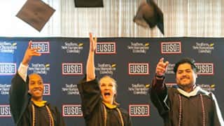 Three SNHU students from Texas tossing their graduation caps