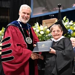 SNHU President Paul J. Leblanc and Mary Beth Dayley, a SNHU graduate with her Master of Art in Creative Writing