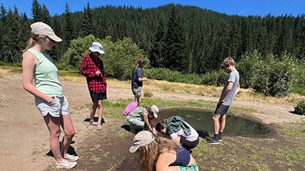 A group of students participating in a group outdoor activity.
