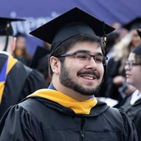 Sultan Akhter in a cap and gown in commencement